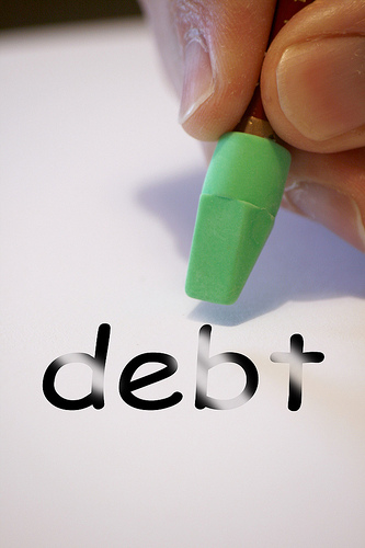 Consumers cutting back on savings to pay down debt